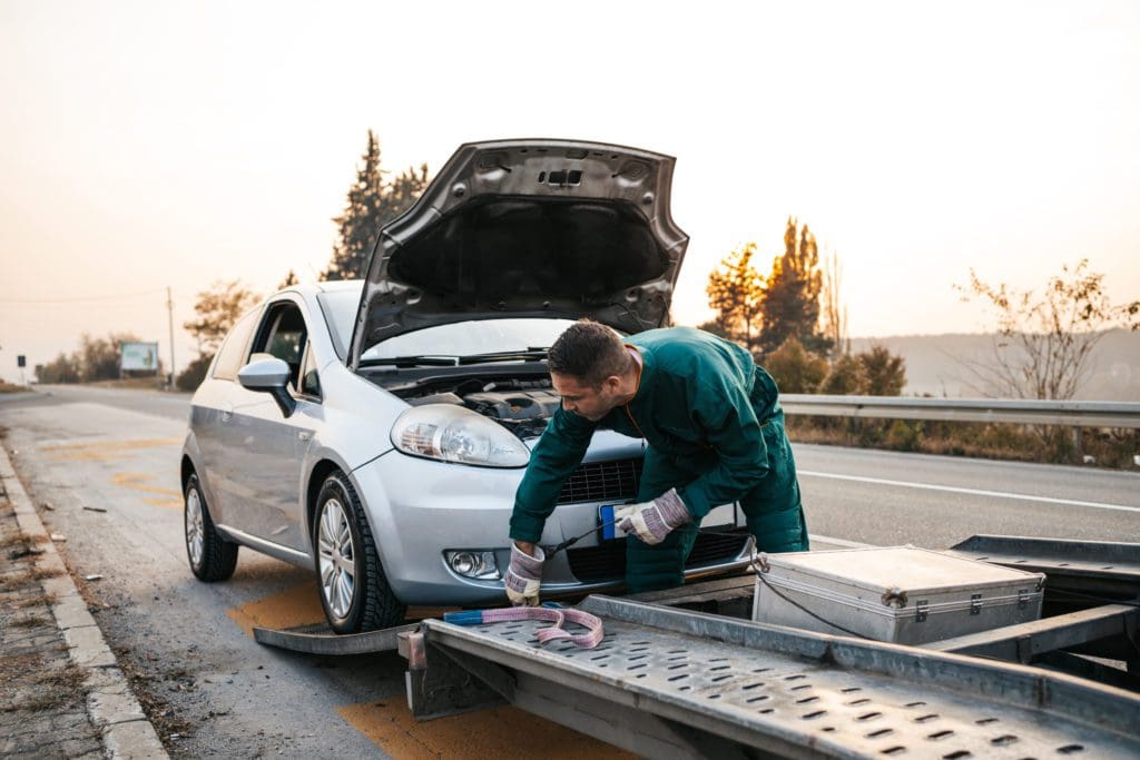 Roadside assistance technician near Custer, South Dakota.