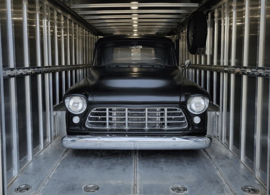 Low clearance Vehicle in enclosed transport, Custer, SD.